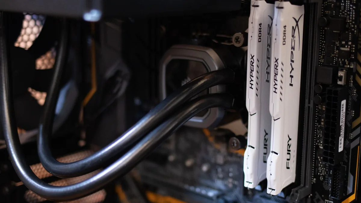 Detailed close-up of computer components including RAM and cables inside a server or high-performance PC.
