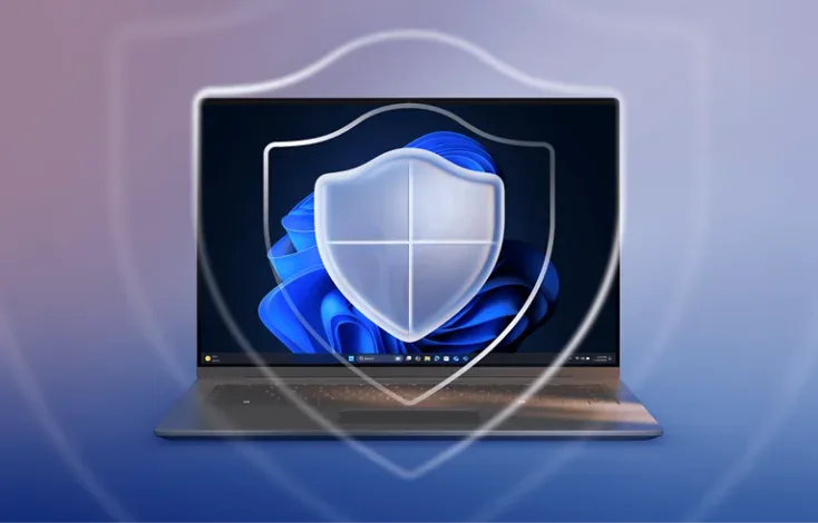 Laptop z ekranem systemu i symbolem ochrony — sterowniki z Windows Update a od producenta